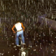 GTA San Andrea's protagonist rides his bike in the rain.